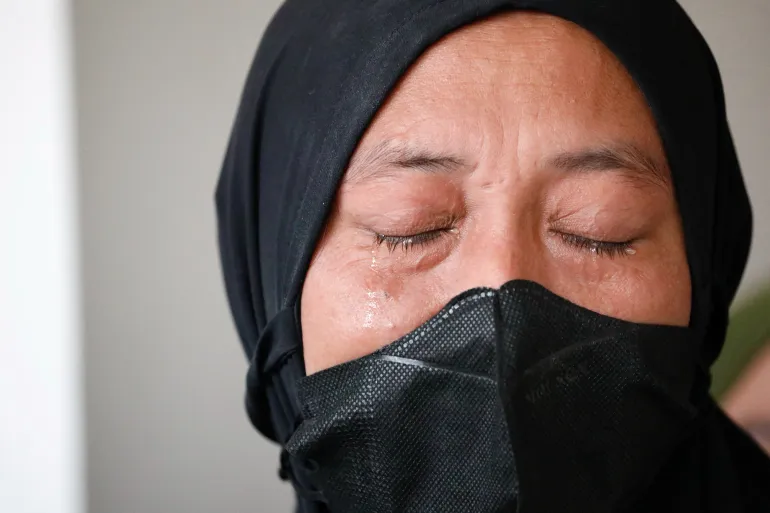Desi Permata Sari cries as she attends the court hearing for the class-action lawsuit earlier this week [Ajeng Dinar Ulfiana/Reuters]