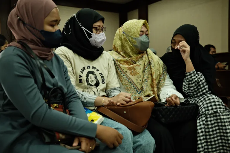 Siti Suhardiyati, Safitri Pusparani, Solihah and Desi Permata Sari say they have found comfort in each other, as they seek justice for their children [Jessica Washington/Al Jazeera]